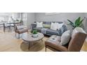 Cozy living room featuring modern furnishings, stylish decor, and hardwood flooring at 3906 Fletcher Ave, Indianapolis, IN 46203