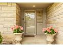 Inviting front entrance with decorative flower pots and clear house number display at 4415 N Illinois St, Indianapolis, IN 46208
