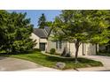 Inviting home with manicured lawn, mature trees, and a convenient two-car garage at 4428 Edinburgh Pt, Indianapolis, IN 46228