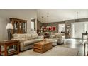 Comfortable living room with ample seating, hardwood floors, and open floor plan at 4428 Edinburgh Pt, Indianapolis, IN 46228