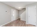 Inviting foyer with hardwood floors, a decorative front door, and easy access to the upper level at 6320 River Valley Way, Indianapolis, IN 46221