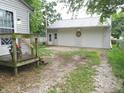 A detached two-car garage with gravel drive and a back porch visible at 6344 Turner Dr, Clayton, IN 46118