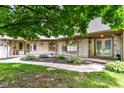 Inviting front entrance with brick facade, well maintained landscaping and charming design at 7220 Normandy Way, Indianapolis, IN 46278
