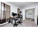 Comfortable office with neutral carpet, gray walls, bright window, and computer desk at 749 Bracknell Dr, Avon, IN 46123