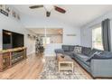 Open-concept living room with views of the kitchen and comfortable sectional seating at 10973 Freeman Ct, Indianapolis, IN 46234