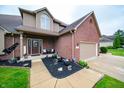 Welcoming front entrance featuring a decorative door, potted plants, and a well-maintained walkway at 1145 Forest Commons Dr, Avon, IN 46123