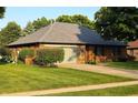 Attractive single-story brick house with a well-kept lawn and attached garage in a quiet neighborhood at 1201 Briarwood Dr, Brownsburg, IN 46112