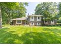 Charming brick and siding home with mature trees and a well-maintained lawn at 12014 Briar Way Center Dr, Indianapolis, IN 46126