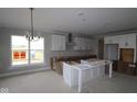Future kitchen with white cabinets, a large center island, and lots of natural light at 12338 French Cattle Way, Noblesville, IN 46060