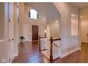Lovely foyer featuring hardwood floors, a staircase, and a bright window above the front door at 13429 Boxelder Ct, Carmel, IN 46074