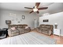 Spacious living room with wood floors, ceiling fan and comfortable seating at 1630 Eastfork Dr, Brownsburg, IN 46112