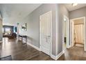 Hallway with hardwood floors provides seamless flow to the living areas and bedrooms at 1893 Devonshire Ave, Avon, IN 46123