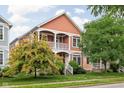 Attractive two-story home with double balconies and mature landscaping at 2326 N Pennsylvania St # 6, Indianapolis, IN 46205