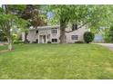 Two story home with inviting front entrance and lush lawn at 233 Saddlebrook Dr, Zionsville, IN 46077