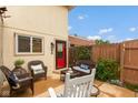 Serene backyard patio setting with cozy wicker furniture and lush greenery, perfect for outdoor relaxation at 2766 Del Prado Dr # 6, Indianapolis, IN 46227