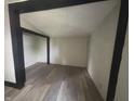 A cozy bedroom showcases new floors and freshly painted walls and trim at 2826 Station St, Indianapolis, IN 46218