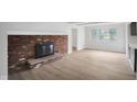 Living room has a cozy brick fireplace and plenty of natural light at 3148 Arbutus Dr, Indianapolis, IN 46224