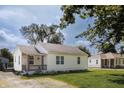 Charming house with cozy front porch and well-maintained yard at 321 S Biltmore Ave, Indianapolis, IN 46241