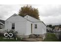 The rear of the property features classic siding and ample yard space, offering great potential at 3954 Fletcher Ave, Indianapolis, IN 46203