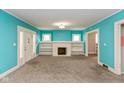 Cozy living room with built-in shelves and a decorative fireplace at 4048 N College Ave, Indianapolis, IN 46205