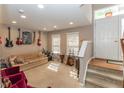 Cozy living room with carpet, comfortable seating, and natural light from the windows at 420 Beverly Ct, Carmel, IN 46032