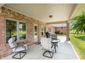 Covered patio featuring comfortable seating perfect for outdoor relaxation and entertaining at 5229 Imperial Dr, Columbus, IN 47203