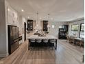Bright kitchen features an oversized island with seating and stainless steel appliances at 5686 Ellie Ct, Noblesville, IN 46062