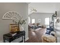Inviting living room featuring hardwood floors, modern decor, and a comfortable seating arrangement at 6529 Lakesedge Dr, Indianapolis, IN 46237