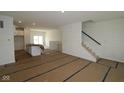 Spacious living room with an open floor plan and access to the backyard at 7071 Pate Hollow Dr, Brownsburg, IN 46112