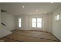Bright living room featuring large windows and ample natural light at 7071 Pate Hollow Dr, Brownsburg, IN 46112