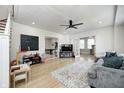 Open-concept living room with hardwood floors, neutral decor, and views into other rooms at 8436 E 56Th St, Indianapolis, IN 46216