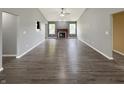 Expansive living area with hardwood floors, a fireplace, and plenty of natural light at 930 Penstock Ct, Avon, IN 46123