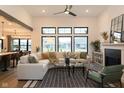 Bright living room with a fireplace, large windows, sectional sofa, and modern decor at 0 Legacy Estates Lot 2, Mooresville, IN 46158