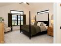 Modern bedroom with a four-poster bed, vaulted ceilings, neutral tones, and cozy furnishings at 0 Legacy Estates Lot 2, Mooresville, IN 46158