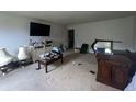A bedroom with neutral walls, television, and carpeted flooring at 12509 Teacup Way, Indianapolis, IN 46235
