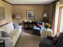 Cozy living room featuring comfortable seating and natural light at 13736 Langley Dr, Carmel, IN 46032