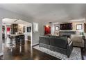 Comfortable living room showcasing hardwood floors and an open kitchen at 1437 Shannon Ave, Indianapolis, IN 46201