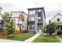 Charming modern homes with stylish exteriors, manicured lawns, and complementing architectural designs at 1452 Fletcher Ave, Indianapolis, IN 46203