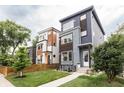 Modern homes with stylish exteriors, manicured lawns, and complementing architectural designs at 1452 Fletcher Ave, Indianapolis, IN 46203