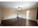 Spacious room with hardwood floors, ceiling fan, and neutral paint, creating a bright, airy space at 1477 Macintosh Ct, Avon, IN 46123