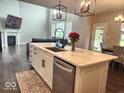 Open concept kitchen with large island, stainless steel appliances and an eat-in dining area at 15873 Hush Hickory Bnd, Westfield, IN 46074