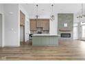 Open concept kitchen featuring an island, stainless steel appliances, and modern lighting at 1677 Solebar Way, Westfield, IN 46074