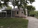 The exterior view shows a screened-in porch and driveway at 1741 N Riley Ave, Indianapolis, IN 46218