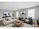 Bright living room with neutral walls, modern furniture, and ample natural light at 1915 Albany St, Beech Grove, IN 46107
