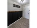 Stylish entryway boasts modern paneling, light wood floors, and an elegant decor sign at 1981 Turning Leaf Dr, Franklin, IN 46131