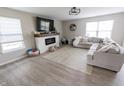 Cozy living room with fireplace and large windows letting in natural light at 1981 Turning Leaf Dr, Franklin, IN 46131