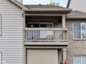 Private condo balcony with wood railing, offering a relaxing outdoor space at 248 Legends Creek Pl # 207, Indianapolis, IN 46229