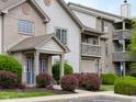 Condominium exterior showcasing brick and siding finishes, with an entrance and balcony at 248 Legends Creek Pl # 207, Indianapolis, IN 46229