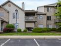 Condominium exterior featuring multiple balconies and well-kept landscaping at 248 Legends Creek Pl # 207, Indianapolis, IN 46229