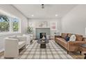 Bright living room with large bay window, fireplace, and a stylish decor rug at 2831 N Talbott St, Indianapolis, IN 46205